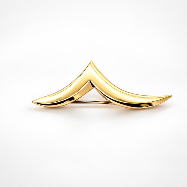 An authentic vintage Tiffany & Co. geometric brooch pin, masterfully sculpted in solid 18k yellow gold. Featuring a sleek,...