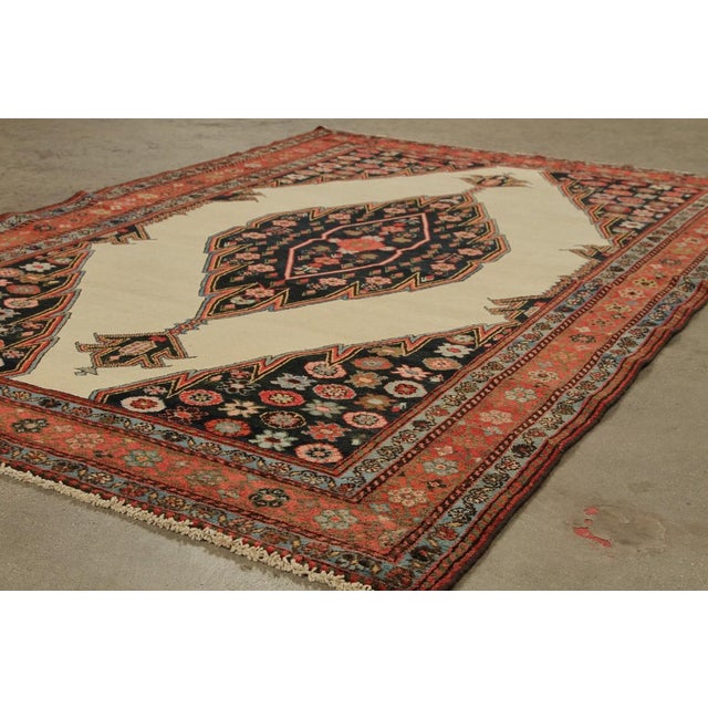 Made with hand-knotted wool circa 1890-1900, this 4x7 antique Persian rug of Mazlaghan provenance is an exciting new...