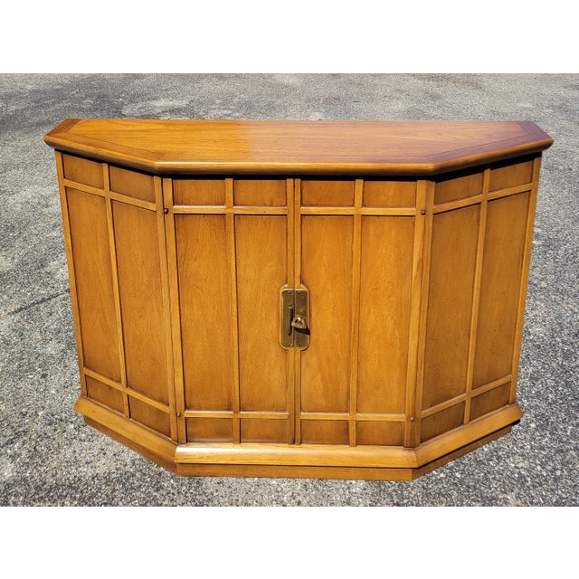 With a striking Danish modern design by mid-century modern pioneer John Van Koert, this tri-front cabinet from Drexel's...