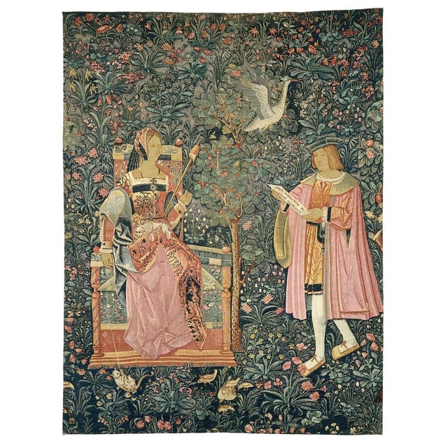 A nobleman reads from a parchment scroll whilst a lady winds wool on a distaff for spinning. Cluny Museum, Paris. This...