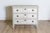 This early 20th-century Swedish chest of drawers, circa 1900, is a refined example of neoclassical Gustavian design....