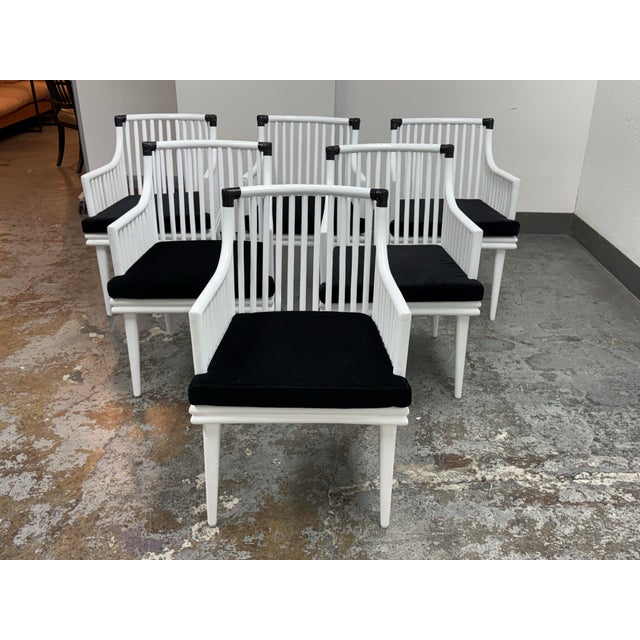 Design Plus Gallery presents a Set of Six Mae Rattan Dining Armchairs from CB2. Each chair has an architectural frame...