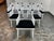 Design Plus Gallery presents a Set of Six Mae Rattan Dining Armchairs from CB2. Each chair has an architectural frame...