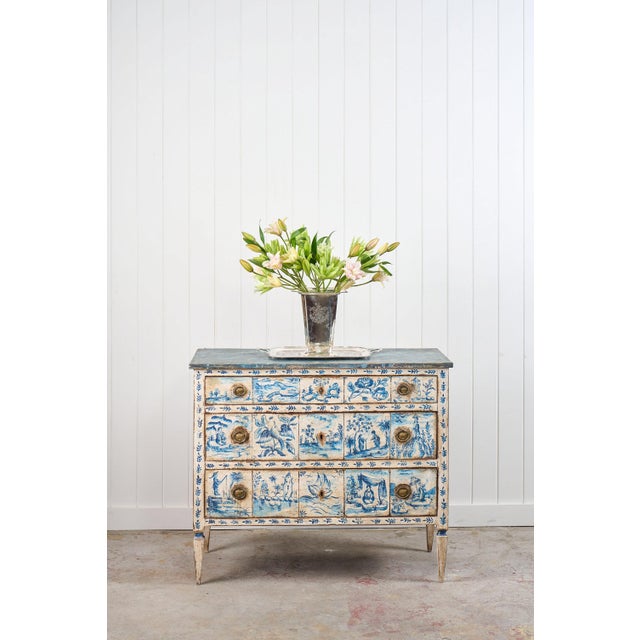 This is a truly incredible 19th century (c. 1840) Italian commode on tapered legs, later painted with blue + white in...