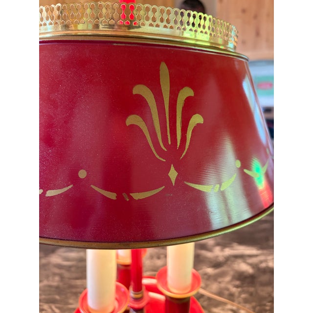 Absolutely gorgeous Red Bouillotte table lamp from the 1950-1960’s French Empire Revival. Triple candlestick on a red...