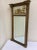 Circa 1800 early american federal eglomise decorated pier mirror with giltwood frame. This has minor damages all over and...