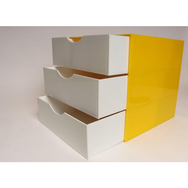Vintage Postmodern lemon yellow acrylic cube storage unit housing three white acrylic drawers with half-moon cut outs for...