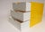 Vintage Postmodern lemon yellow acrylic cube storage unit housing three white acrylic drawers with half-moon cut outs for...