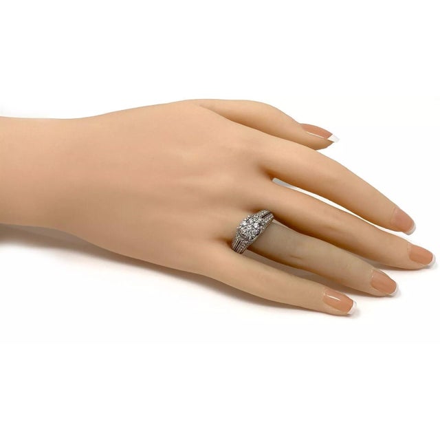 This is a beautiful engagement ring, it is crafted from solid 14k white gold with a polished finish. It has a fancy design...