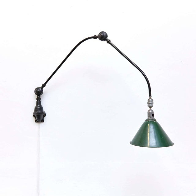 Wall lamp designed by Johan Petter Johansson. Manufactured by Triplex (Sweden), circa 1930. Aluminium and steel. Measures:...