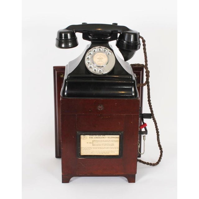 This is a rare vintage GPO desktop or wall cradle fire emergency telephone 164 in black Bakelite together with a...