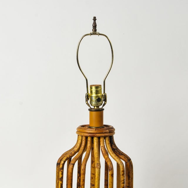Stunning tortoiseshell bamboo midcentury statement lamp with expertly crafted bent bamboo form and coiled bamboo base. In...