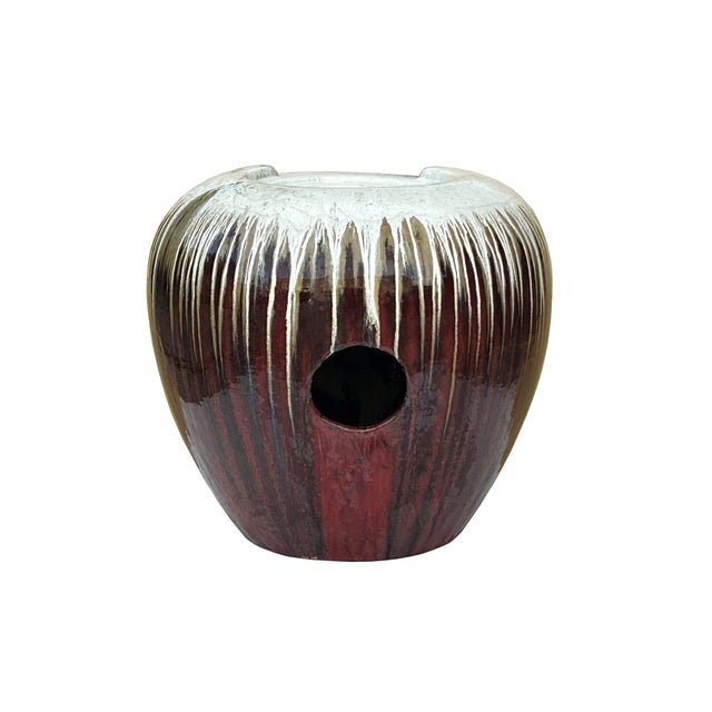 This elegant ceramic fountain features a deep, oxblood-red glazed finish with a contrasting cream and white toned "drip"...
