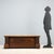 Mid-20th century walnut chest featuring an elegantly carved front panel. The projecting uprights consist of pairs of...