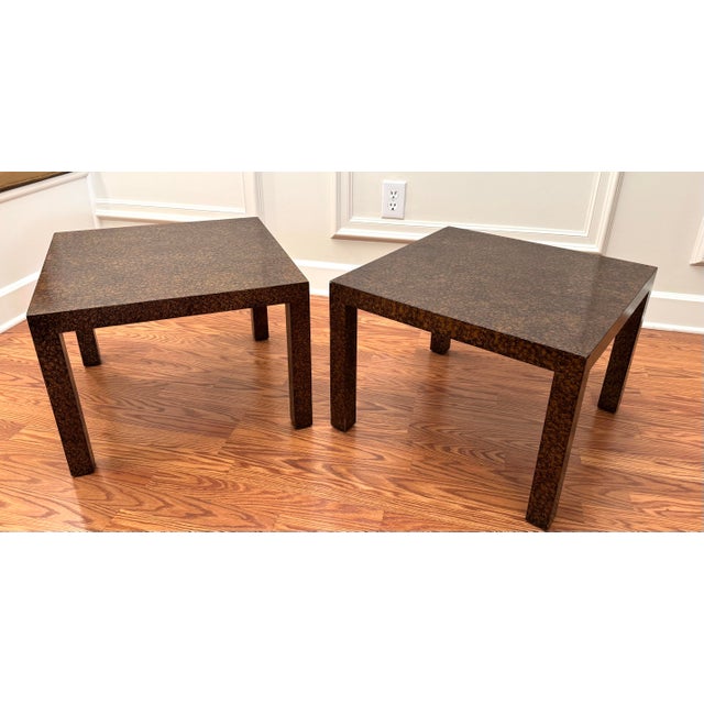 A crackled shimmering mottled brown and amber finish which is lacquer painted in the style of tortoise shell encompass the...