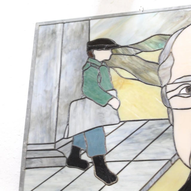 Portrait of a middle-aged man created in stained glass with references to his paperboy career and hometown with mountains...