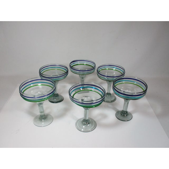 Set of 6 hand crafted, mouth blown Mexican margarita glasses. They have applied multi colored raised stripe patterns in...