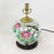 This antique table lamp is repurposed from an authentic white porcelain vase decorated in a vibrant Famille Rose palette....