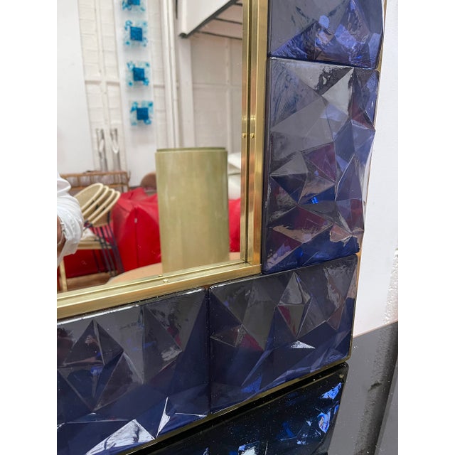 Contemporary wall mirror, full brass and large pieces of blue murano glass with relief diamond point. Small artisanal...