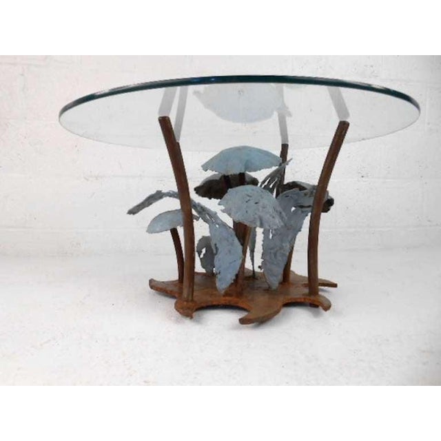 This unique metal sculpture cocktail table features Seandel's fantastic artistic design. Complete with glass tabletop,...