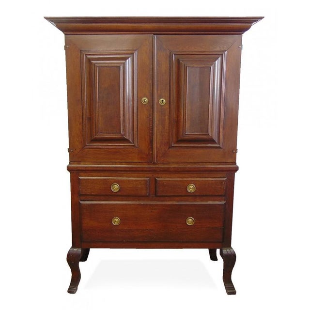 This antique Swedish pharmacy cabinet dates to the 1750s and retains all of its original detailing.