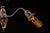 Antique triple-arm gooseneck chandelier constructed from copper with a dark japanned finish. Three curved arms extend from...
