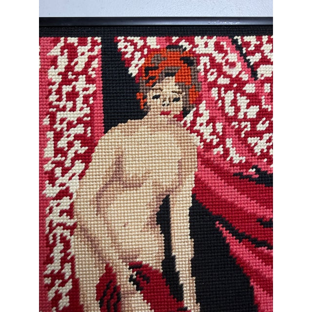 Unique handmade needlepoint with nude lady. Includes black frame.