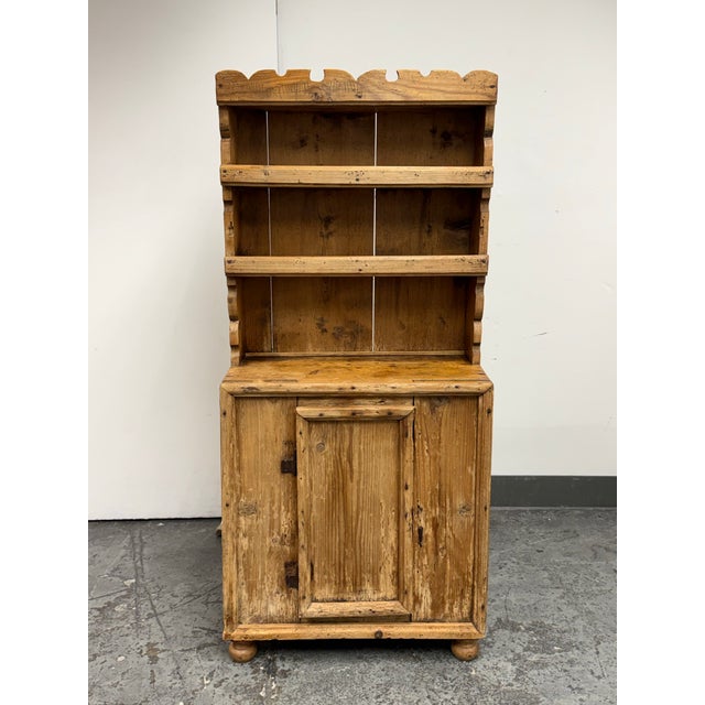 Design Plus Gallery presents an Antique European Pine Open Hutch Cupboard, Circa 1830. This early 19th-century case piece...