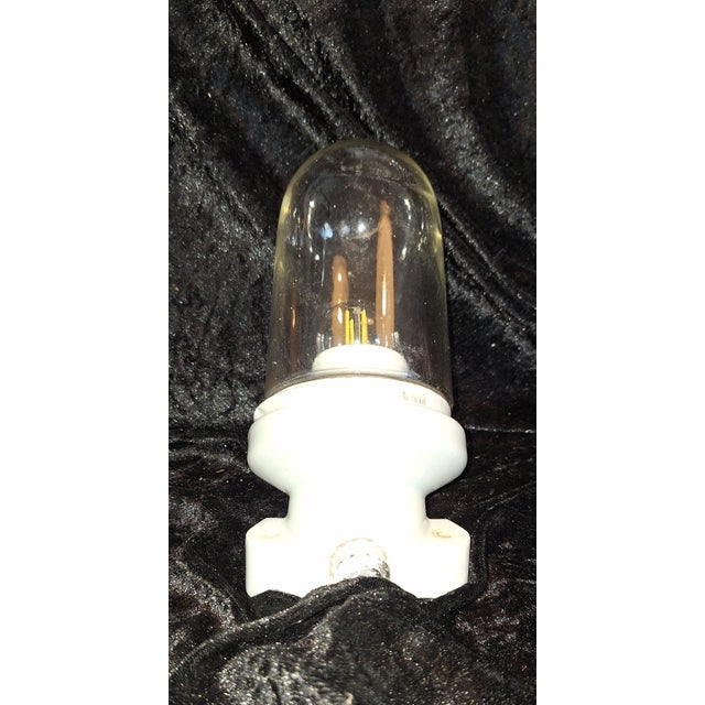 Art Deco Wall Lamp with Porcelain Base and Teardrop-Shaped Glass Shade, 1930s, in Very Good conditions. Designed 1920 to...