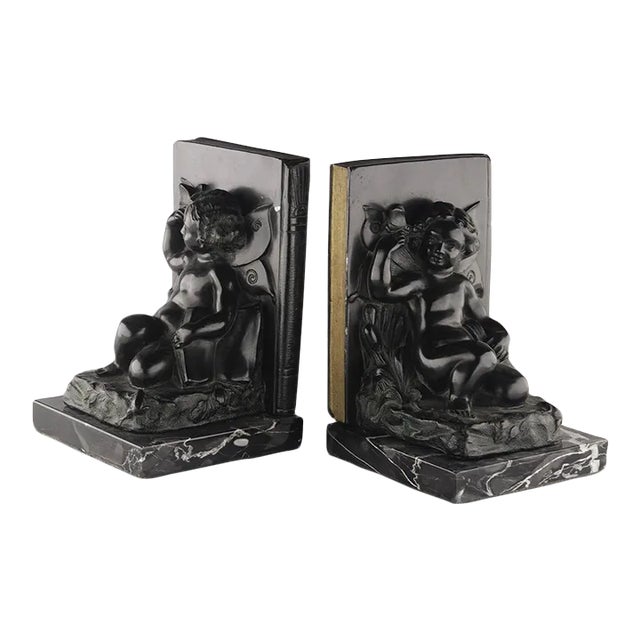 Set of 2 Early 20th Century French Art Déco Zamac Winged Cherub/Fairy Child Bookends With Marble Base For Sale