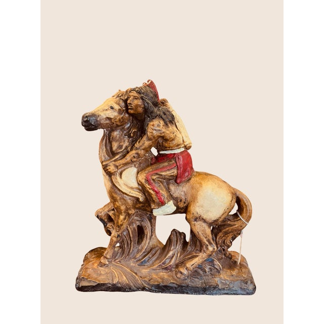 This is a lovely handmade sculpture of an American Indian on Horseback. Most likely made in the 1960s, it displays the...