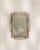A refined Art Deco mirror with a brass frame, characterized by geometric clarity and symmetrical proportions. The warm...