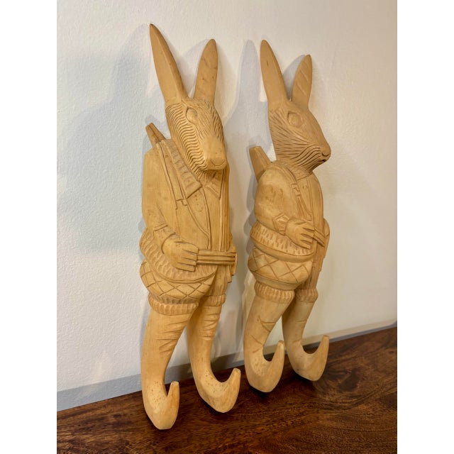 A charming pair of vintage hand carved wooden rabbit wall hooks, handcrafted in the Philippines. Each whimsical rabbit is...