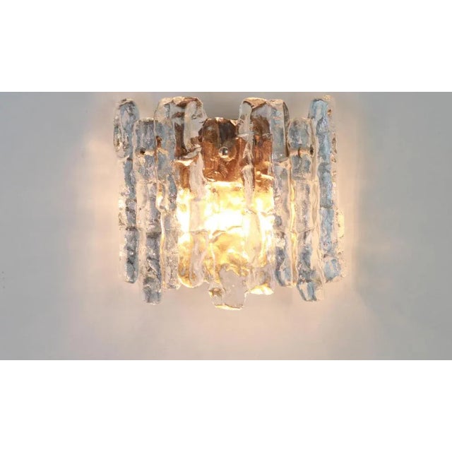 Wonderful pair of midcentury wall sconces with ice glass, made by kalmar, austria, manufactured, circa 1960-1969. High...