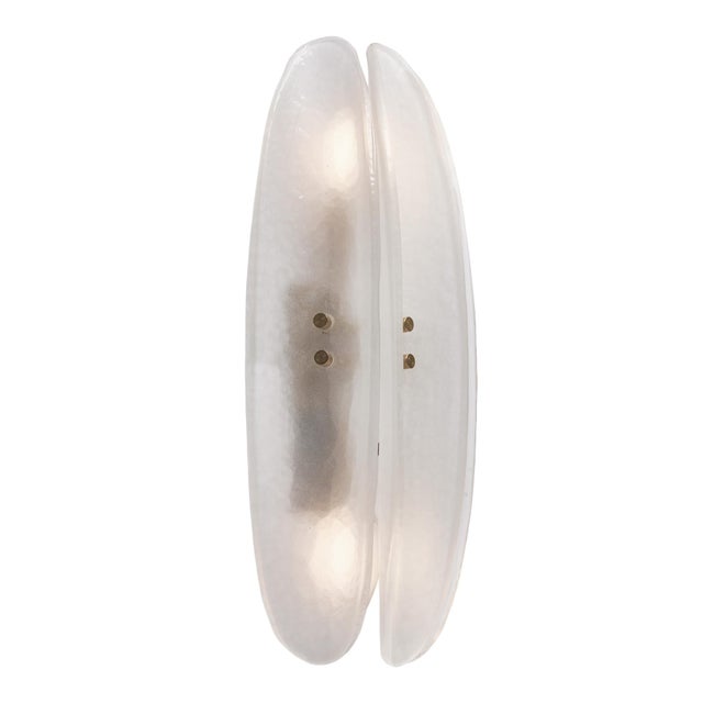 Pair of Murano glass paneled sconces, each crafted with three frosted curved components of hand made white glass on a...
