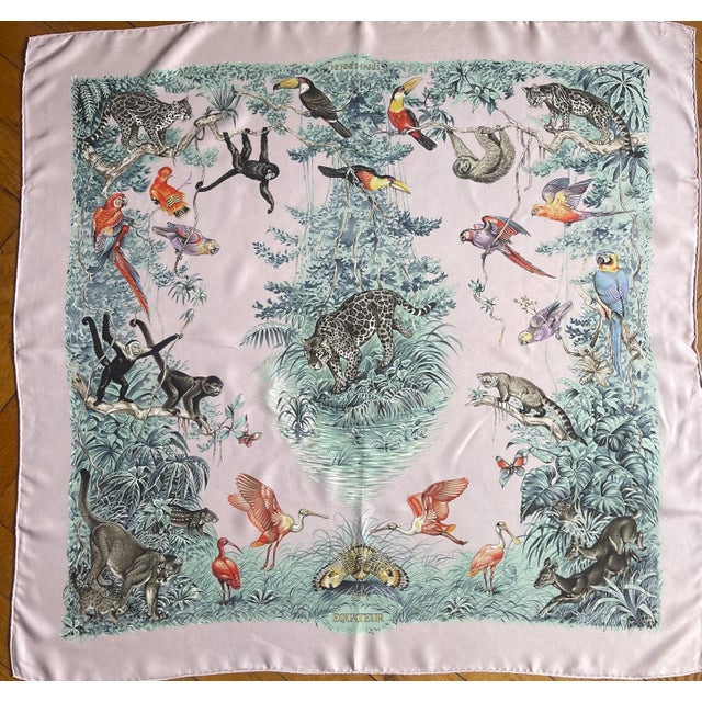 Hermès Équateur HERMES Ecuador pink silk scarf by Robert Dallet from 1988 This scarf depicts the exceptional wildlife of...