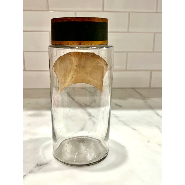 Apothecary jars like this one were commonly used in pharmacies and apothecaries from the 18th through the early 20th...