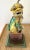 Yellow glazed Chinese ceramic Foo Dog on a bronze base table lamp. With pleated Shade. Lamp measures 5.5” x 6” x 24”H top...