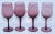 A beautiful set of four vintage French hand-blown stemmed wine or water glasses, circa 1980, in a sophisticated amethyst...