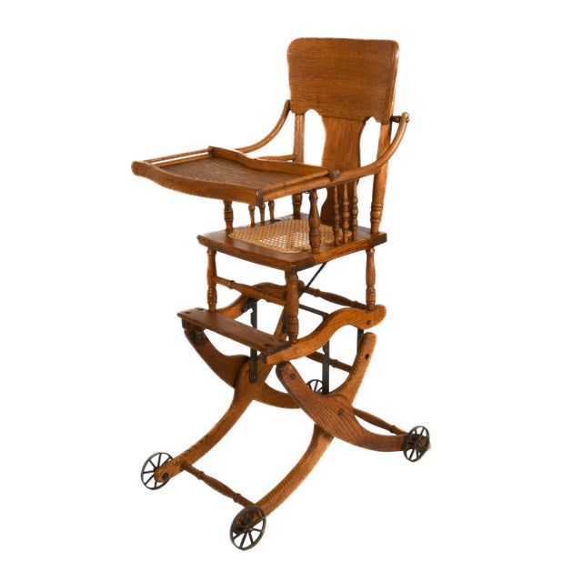 This antique Victorian convertible highchair stroller is a compelling example of late 19th- to early 20th-century...