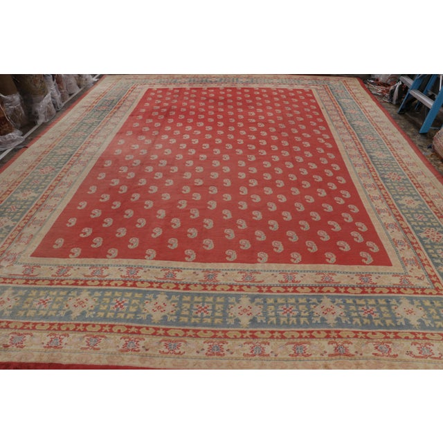 Hand-knotted in wool, an antique 13x16 Oushak rug from Turkey circa 1900-1910 - making way to Rug & Kilim’s antique...