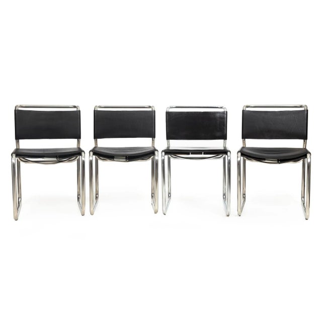 SET OF EIGHT DOUBLE-CANTILEVER BLACK LEATHER "CH66" DINING CHAIR BY NICOS ZOGRAPHOS United States, circa 1970s Item #...