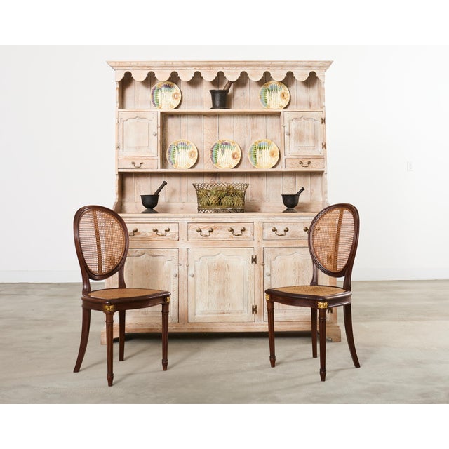 Gorgeous country English provincial Welsh cupboard, sideboard, or dresser crafted from oak. The Georgian style case...