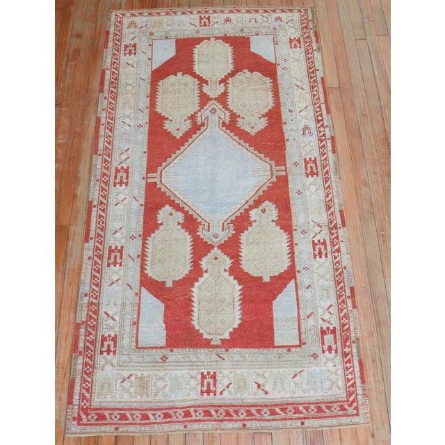 A mid 20th-century decorative vintage-inspired Caucasian rug