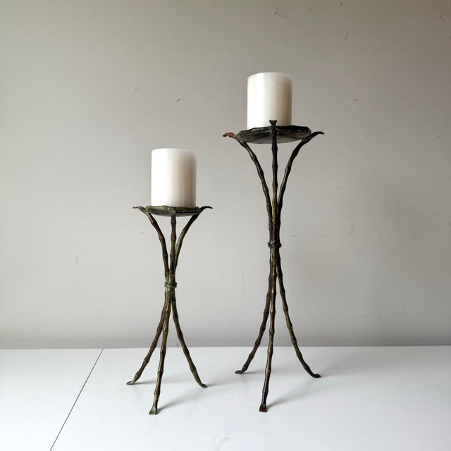 Vintage verdigris iron bamboo candleholders fit for pillar candles. The pair have a lovely curved design.