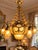 This impressive circa 1970 French Louis XVI Revival chandelier combines substantial solid-bronze construction with vibrant...