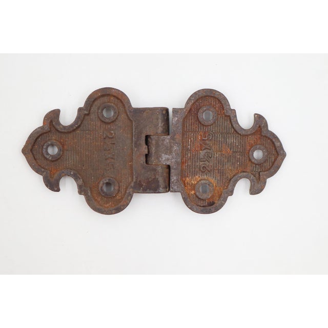 Victorian style butterfly ice box hinge made of cast iron with a bronze finish. The original mounting screws are not...
