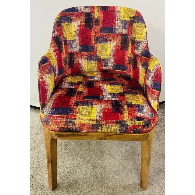 A stylish pair of Mid Century Modern style barrel chairs. The chairs feature a recent upholstery in vivid dark blue,...