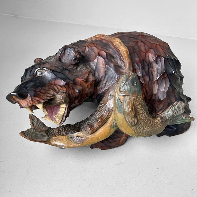 This impressive wooden bear is a beautiful example of traditional Kibori Kuma woodcarving (木彫り熊), originating from...