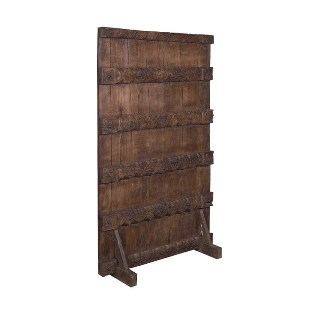 Dimensions: 36.5" W x 16" D x 64" H This piece utilizes old architectural elements, re-claimed woods and is handcrafted by...